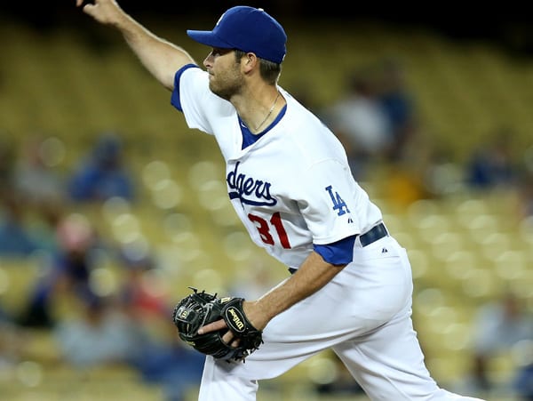 Catcher Drew Butera threw a perfect inning of relief in the Dodgers' 13-3 loss. (Stephen Dunn/Getty Images)